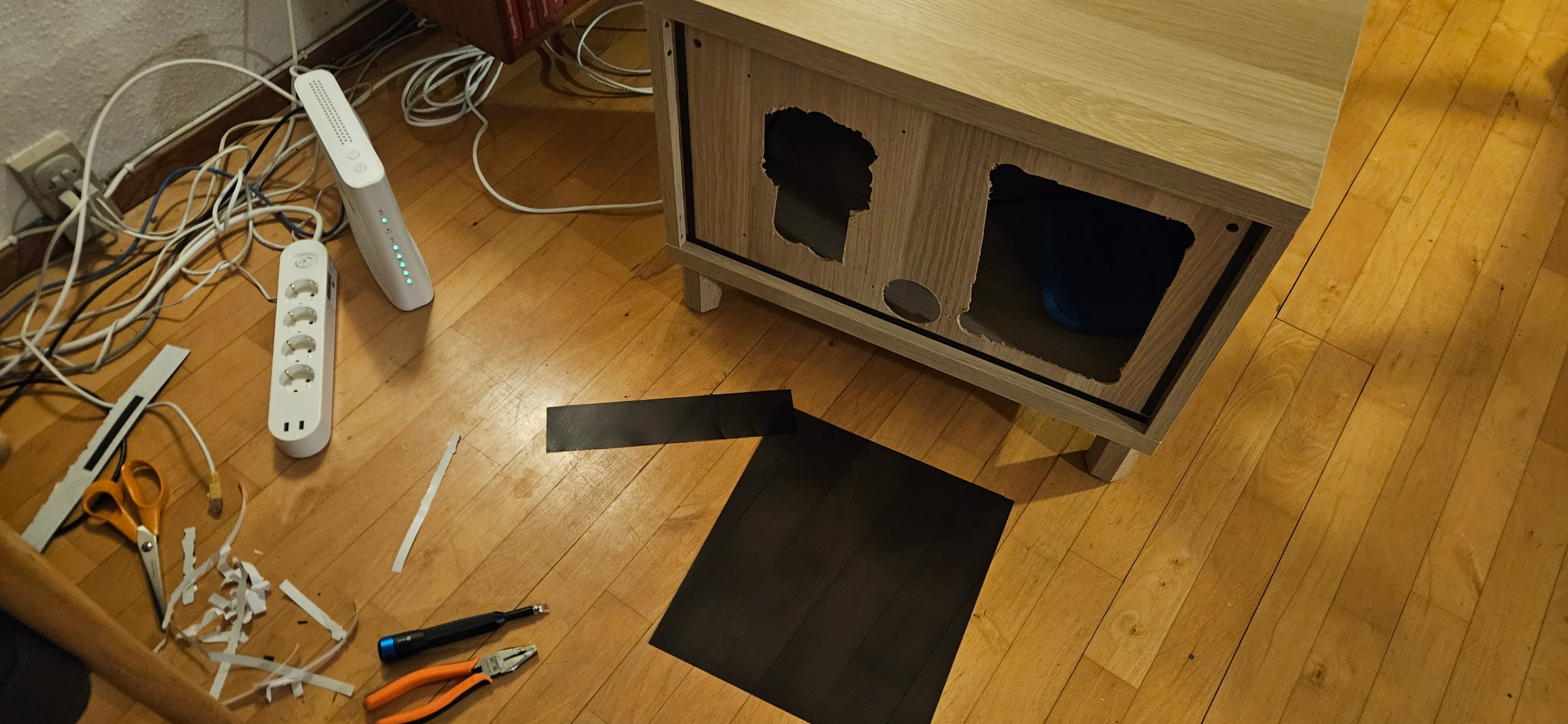 One of the large openings cut into the back of the cabinet